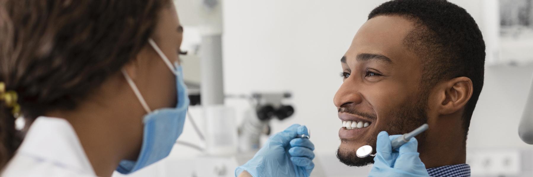 man smiling after getting dental implants in grand rapids